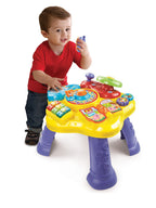 Bilingual Spanish and English educational toy layout with colorful gear elements.