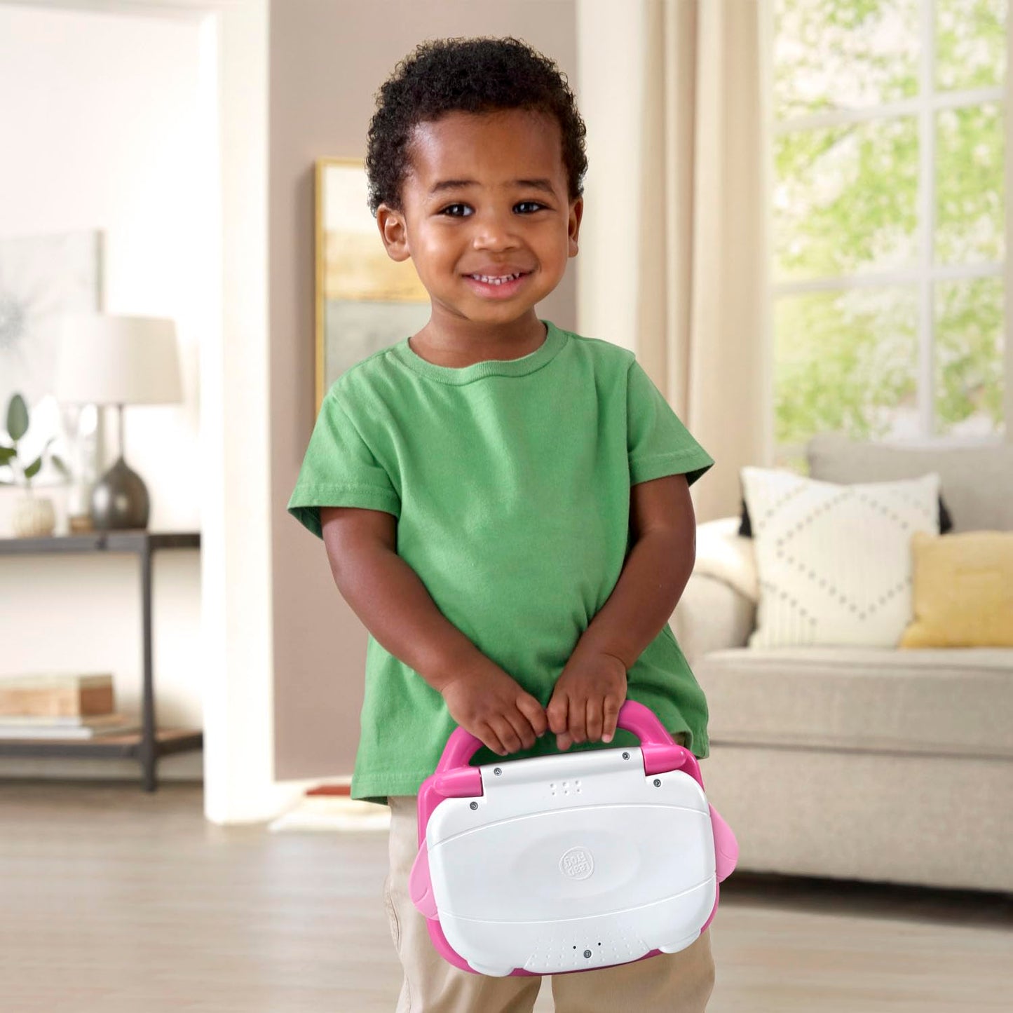 Back view of LeapFrog pink laptop for kids showing secure battery compartment area
