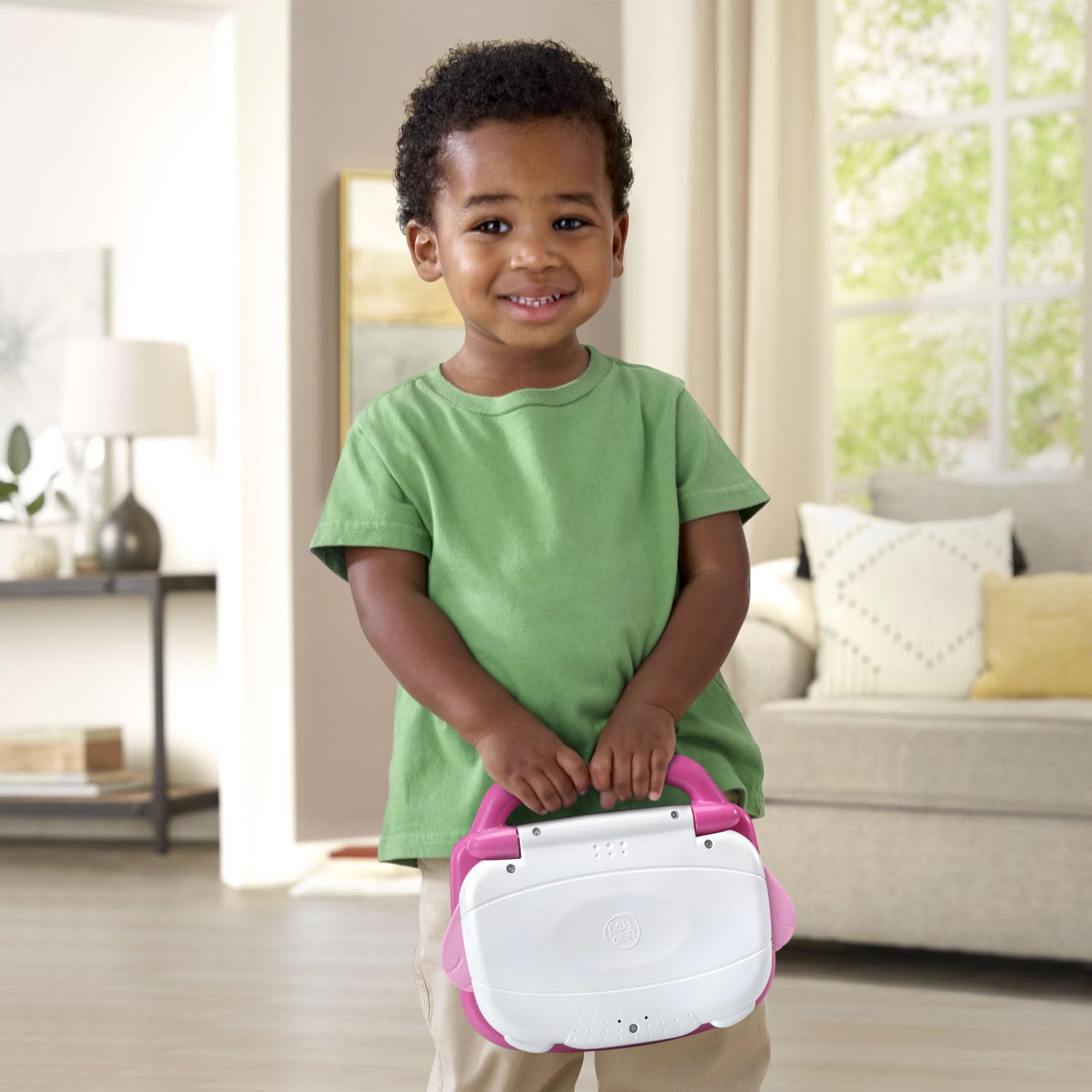 Back view of LeapFrog pink laptop for kids showing secure battery compartment area