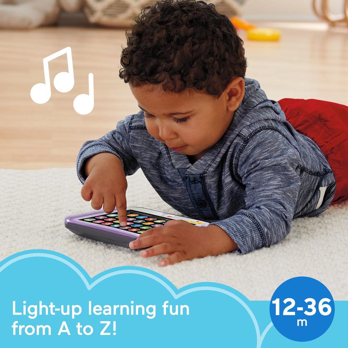 Fisher-Price electronic learning toy showing the active multi-color lights glowing along the borders during musical playback.