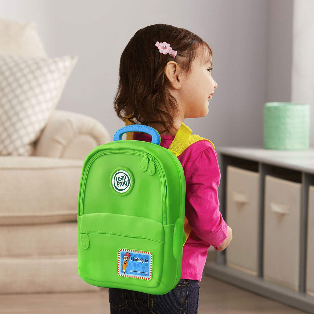 Back view of the green LeapFrog learning backpack showing adjustable shoulder straps