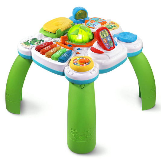 LeapFrog interactive toddler desk featuring toy laptop globe and crayon piano keys