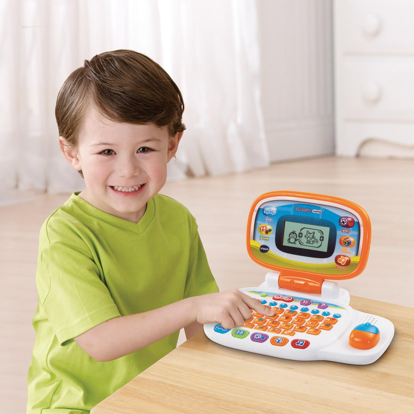VTech children's portable laptop demonstrating the interactive progressive learning activity screen.