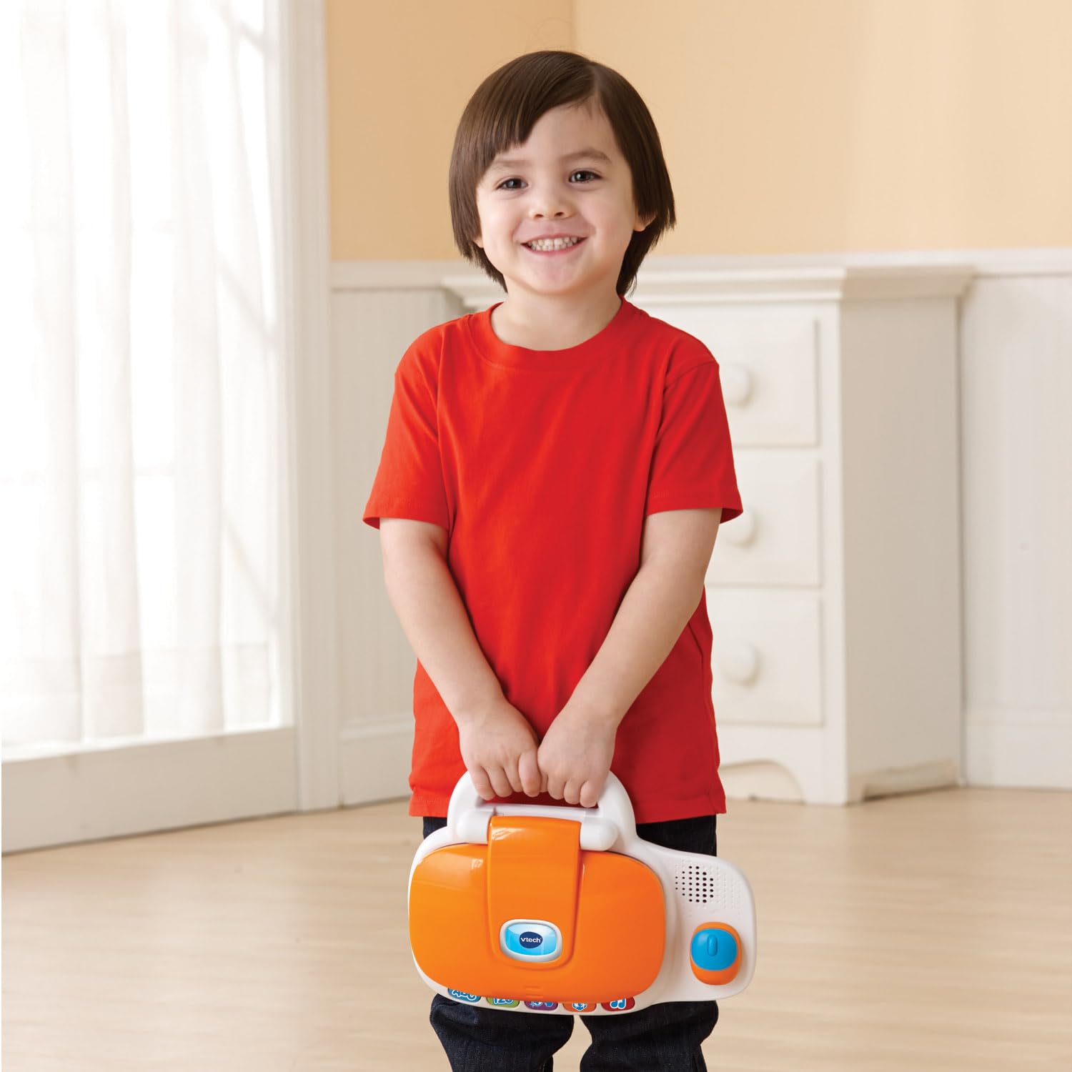 VTech multi-colored orange tech toy for toddlers displaying the numerical row layout.
