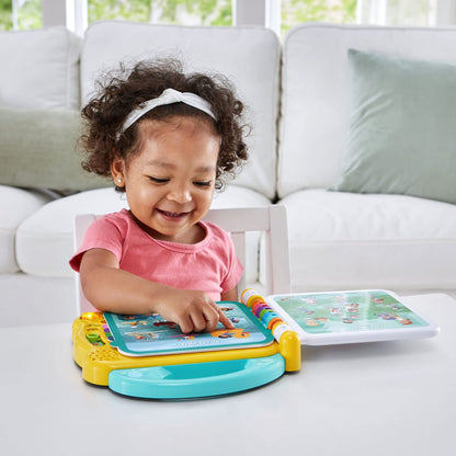 LeapFrog educational bilingual book rear view showcasing the secure battery compartment and volume controls.