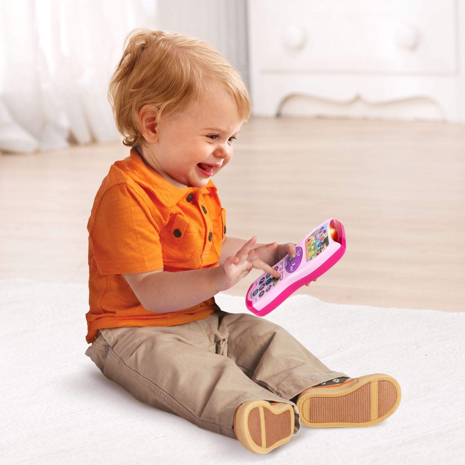 Packaging box view of the USA imported LeapFrog Violet's learning remote in exclusive pink color option.