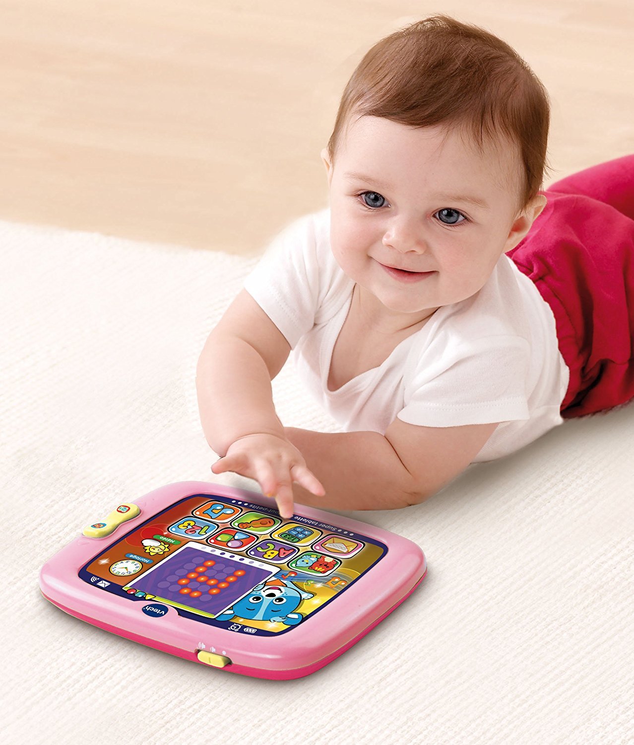 VTech electronic toddler learning device showing glowing screen features in pink color