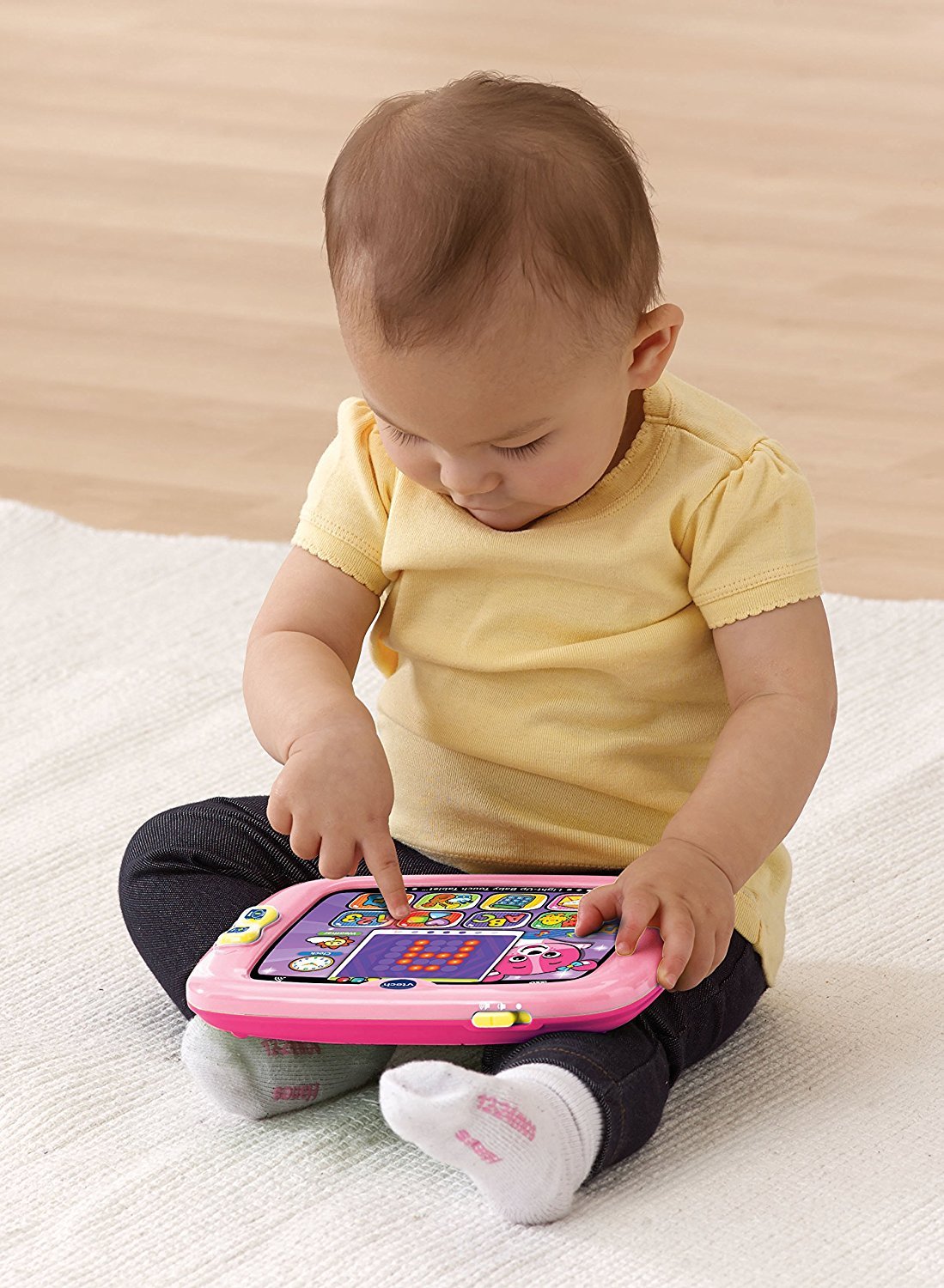 Side profile of VTech educational infant tablet detailing child friendly durable construction