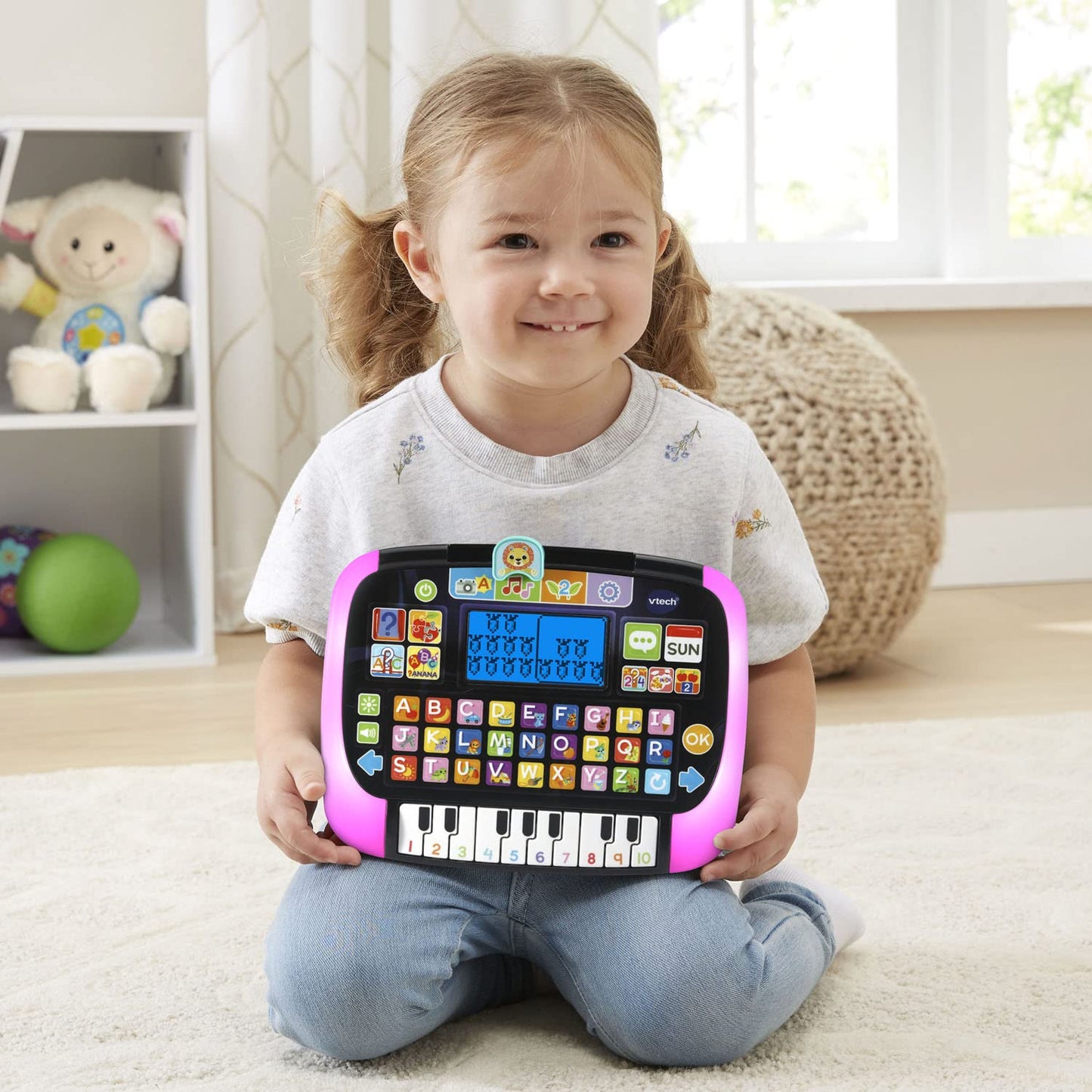 Back side of the black VTech toddler tablet showing the secure battery compartment lock