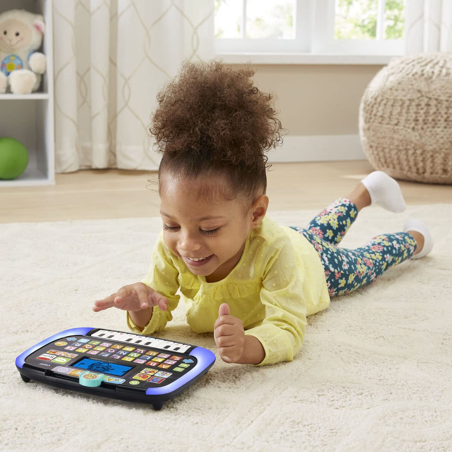 Side view demonstrating the slim portable design of the VTech early learning tablet toy