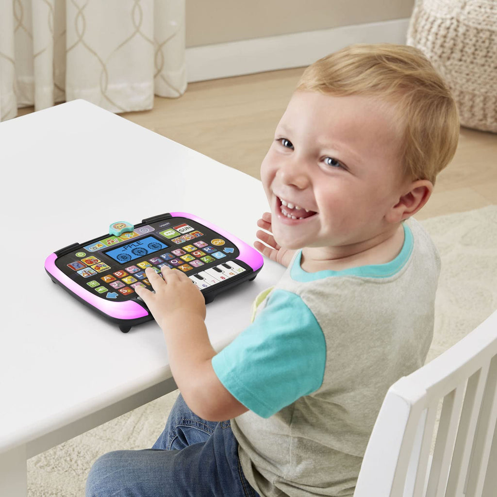 VTech preschool tablet toy illuminating in bright pink light during a counting game sequence