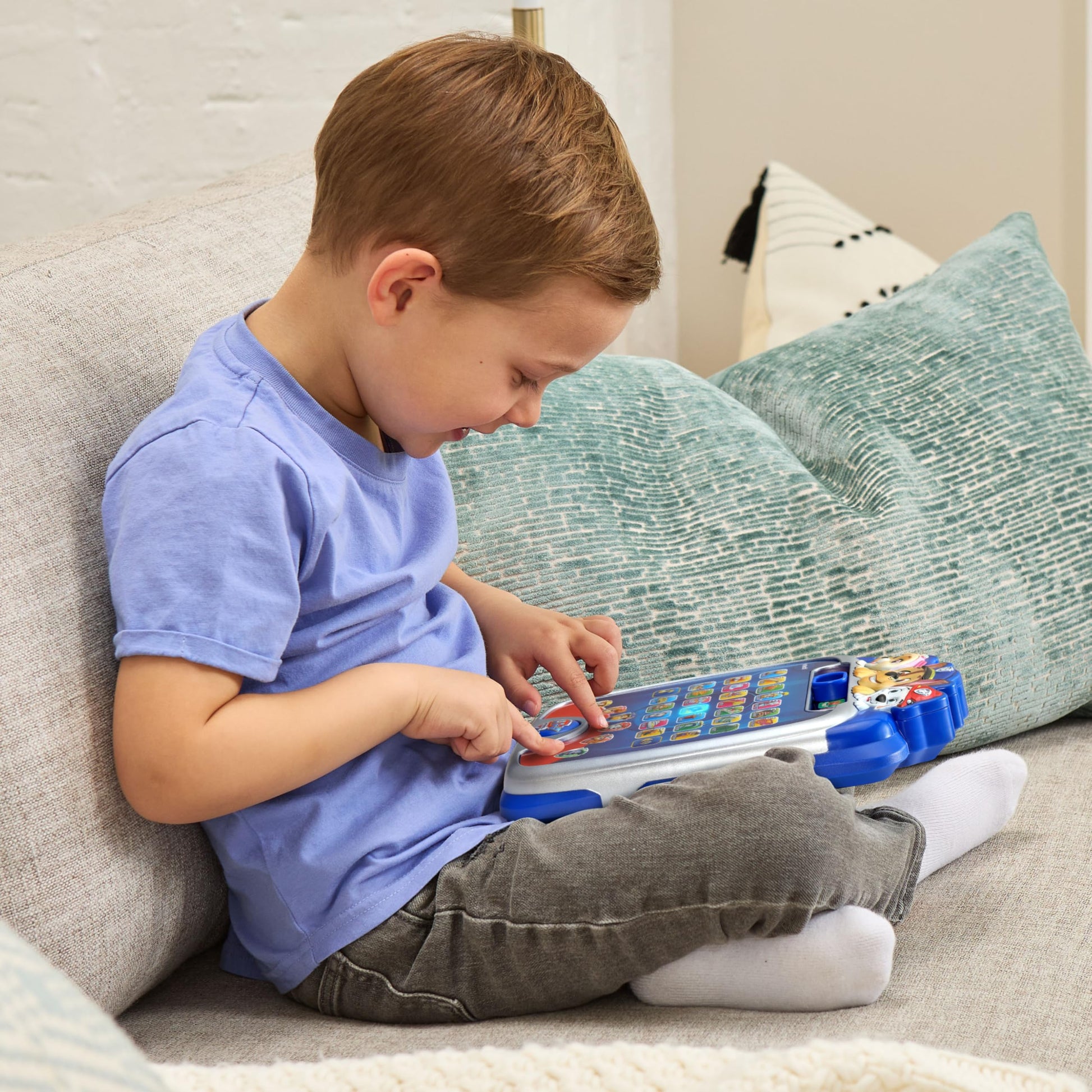 Side profile of the preschool electronic device showing the portable handheld design and comfortable grip edges.