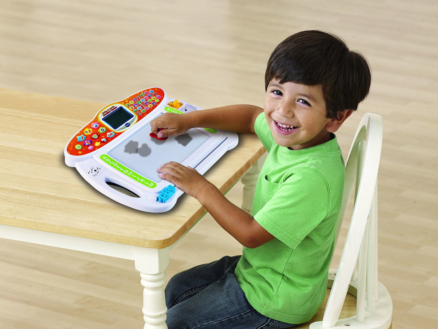 VTech creative learning toy showing included plastic stencils and custom shape stamps