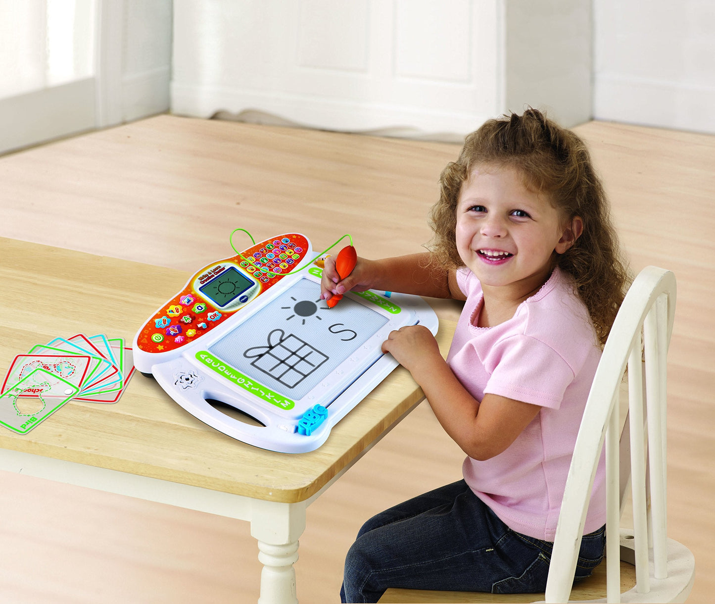 Close up of electronic stylus tracing lines on the white magnetic drawing pad