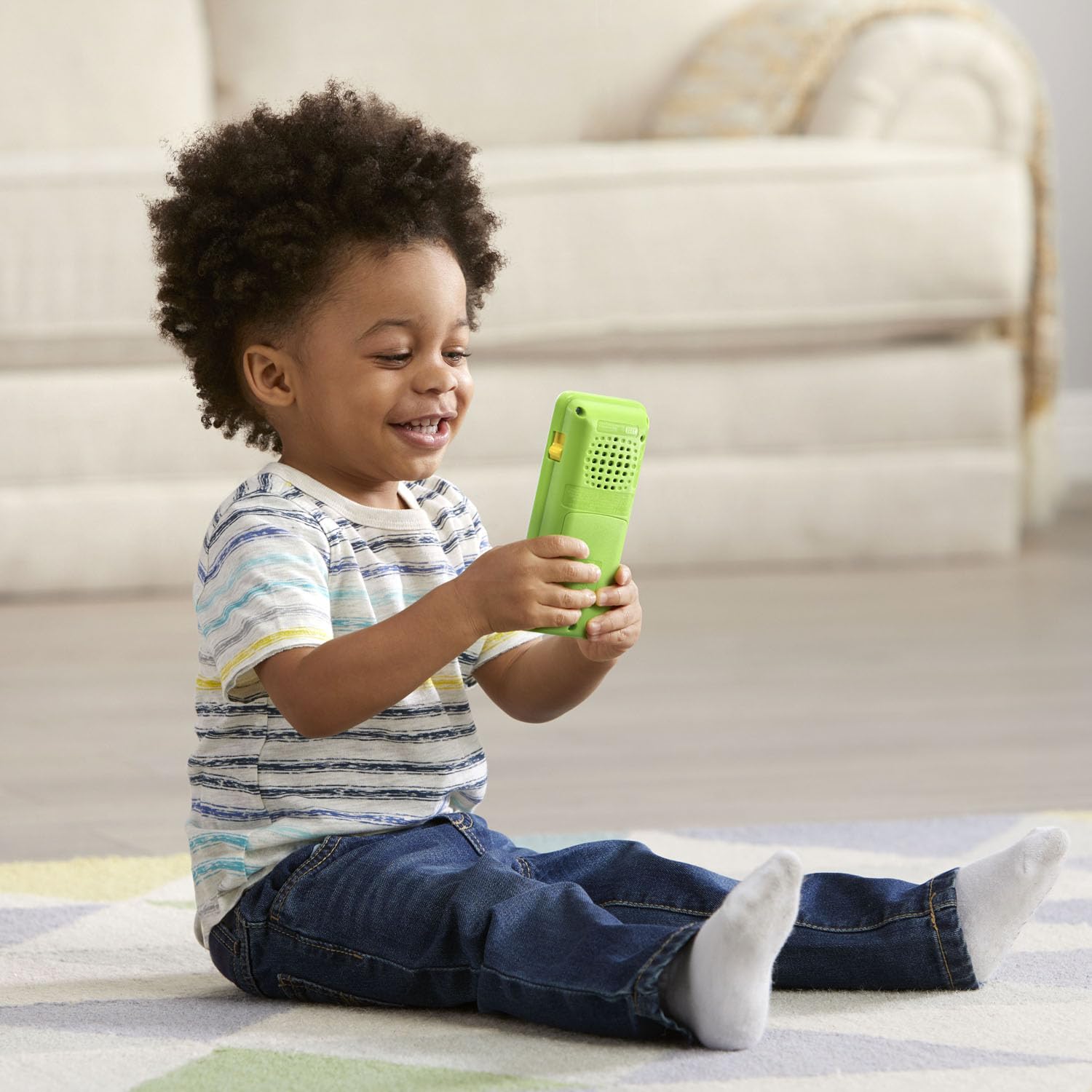 Educational green toy smartphone with emoji sound effect buttons for toddlers