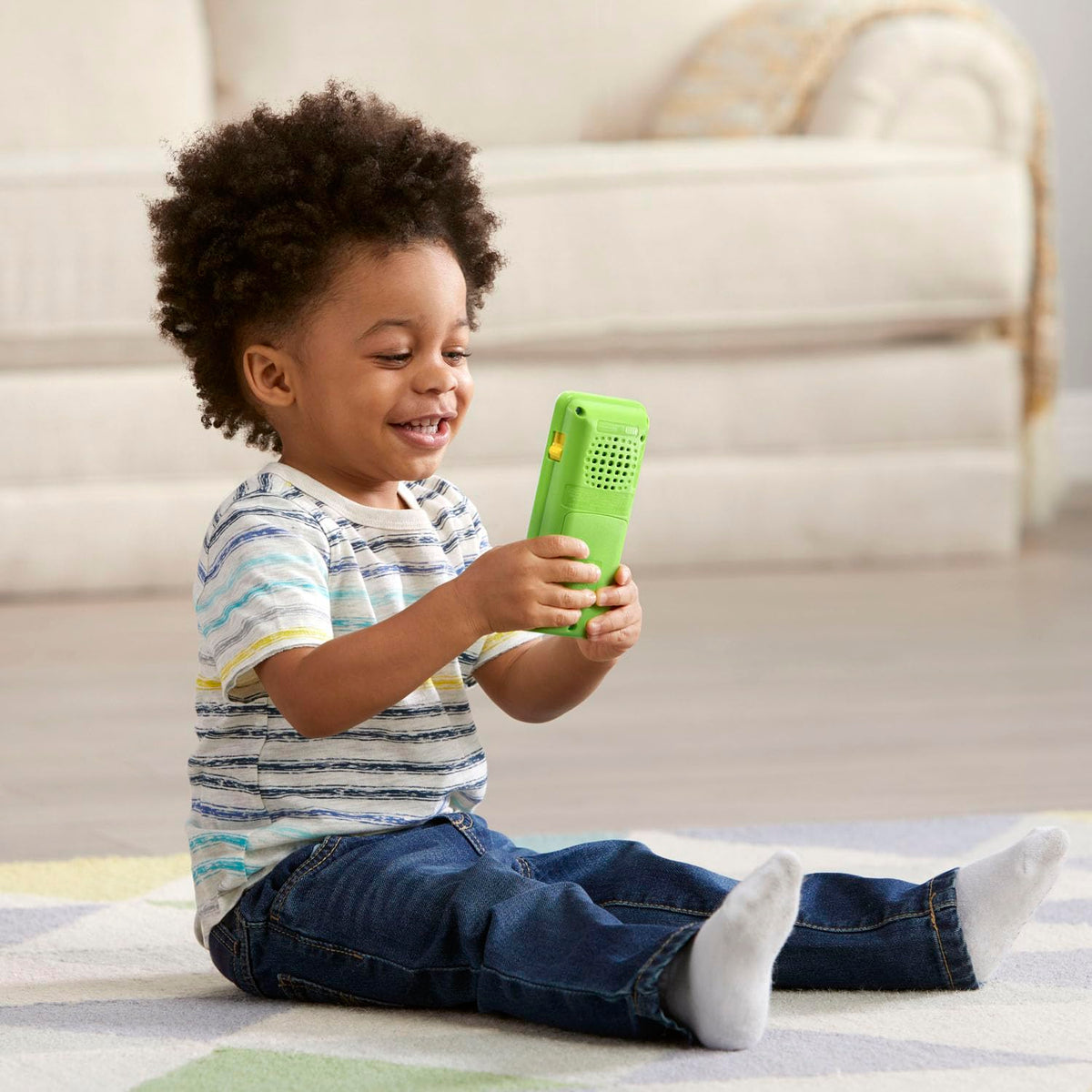 Educational green toy smartphone with emoji sound effect buttons for toddlers