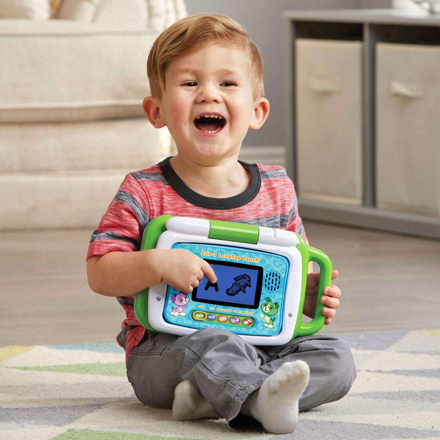 Close up of the green LeapFrog child tablet screen showing a letter critter animation