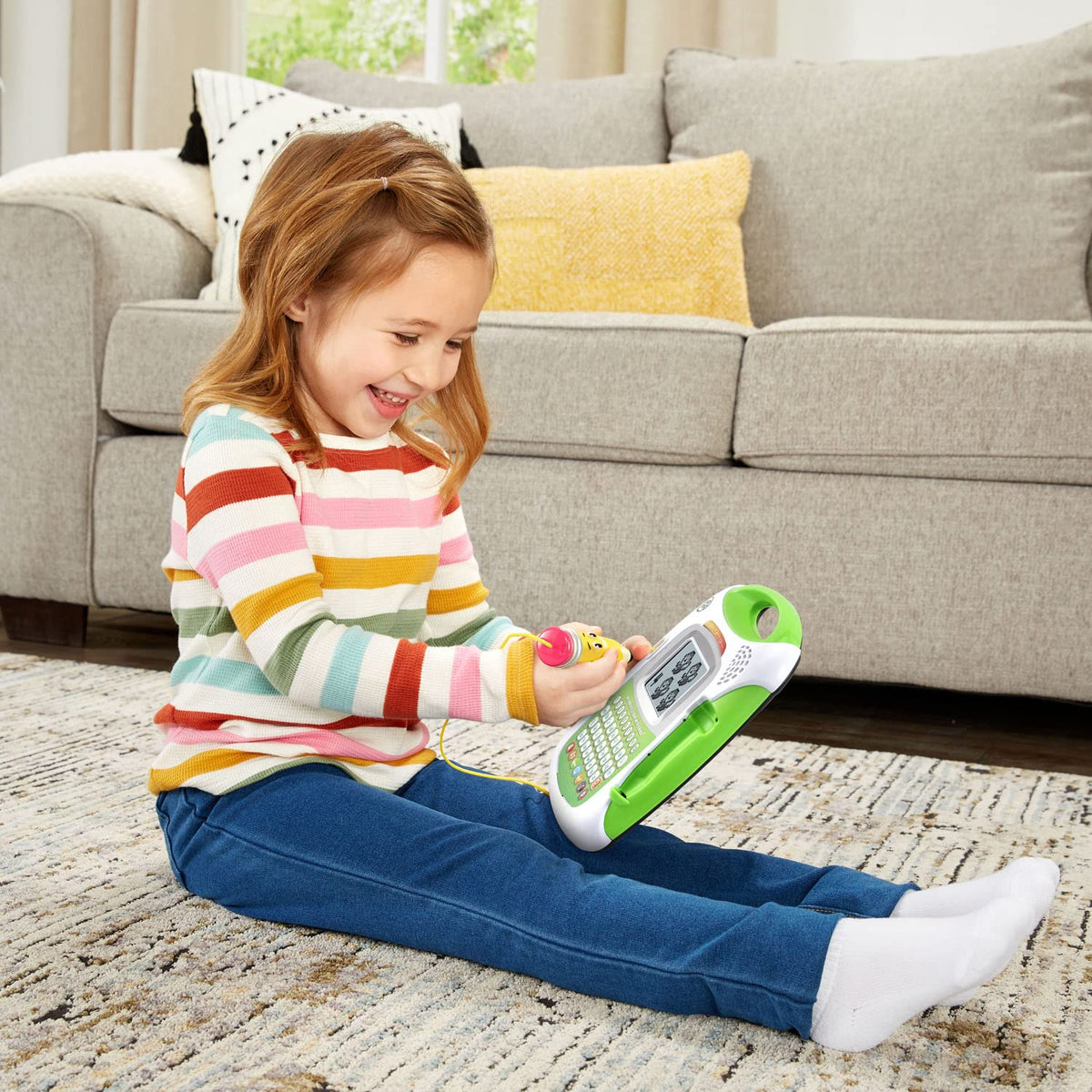 LeapFrog kids writing practice tool with personalized name entry interface on green outer shell