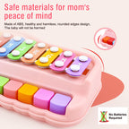 Fizzy Funs Montessori toy keyboard being struck gently by two child safe mallets