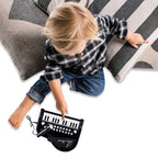 Love&Mini 24 keys educational toy piano displaying the rear side auxiliary input ports
