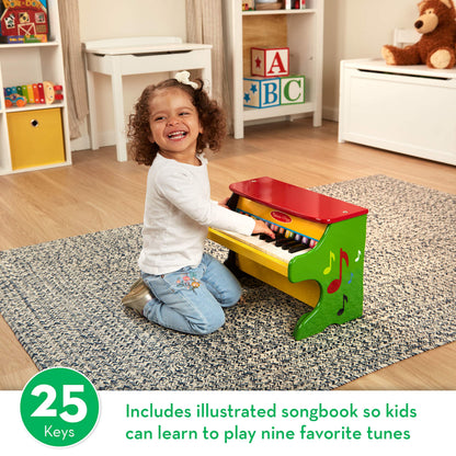 Melissa & Doug wooden toy piano angled view displaying the sturdy upright hardwood construction.
