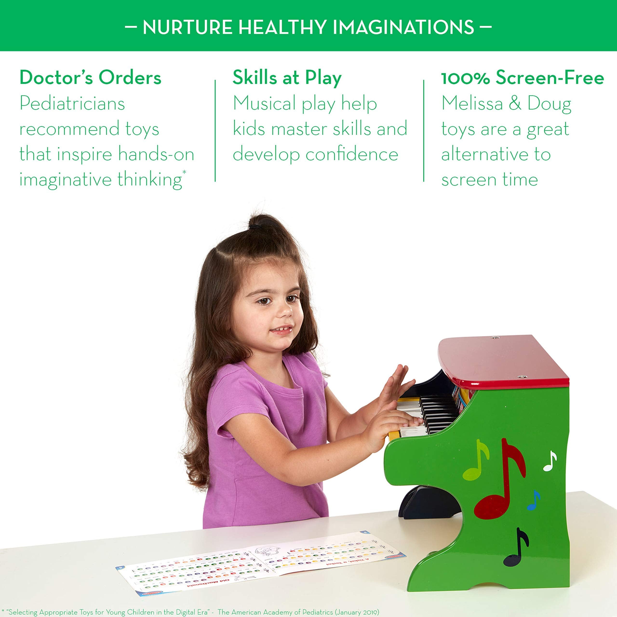 Melissa & Doug educational musical instrument for kids with the color coded songbook open.