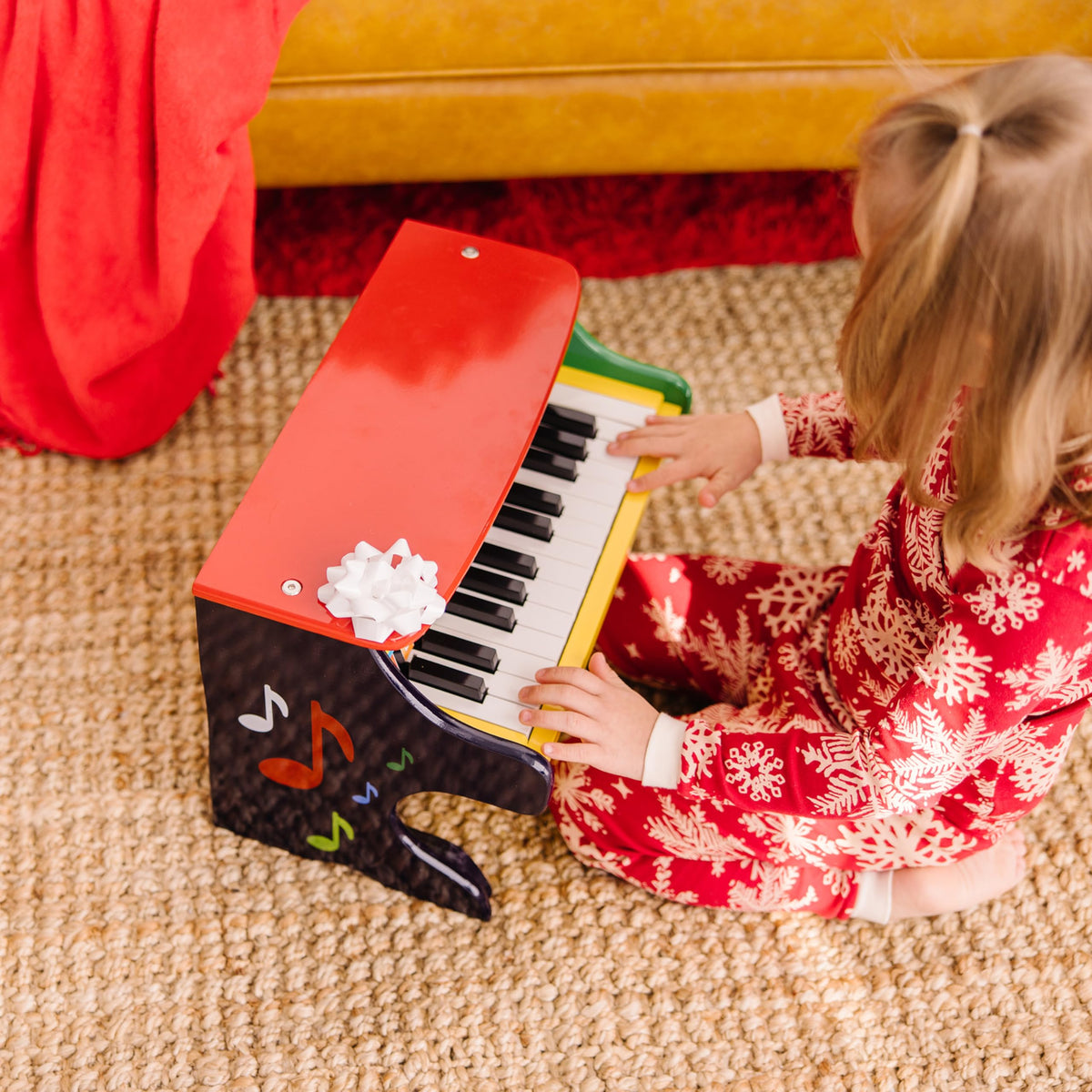 Melissa & Doug children's musical toy with the included illustrated instructional key chart.