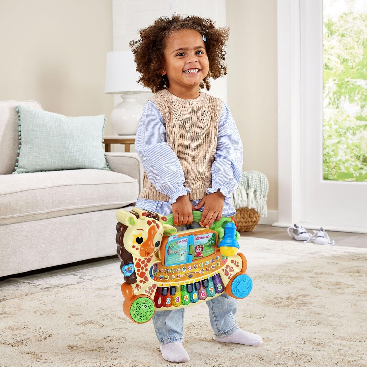 Educational children keyboard demonstrating the light up note matching sheet music feature