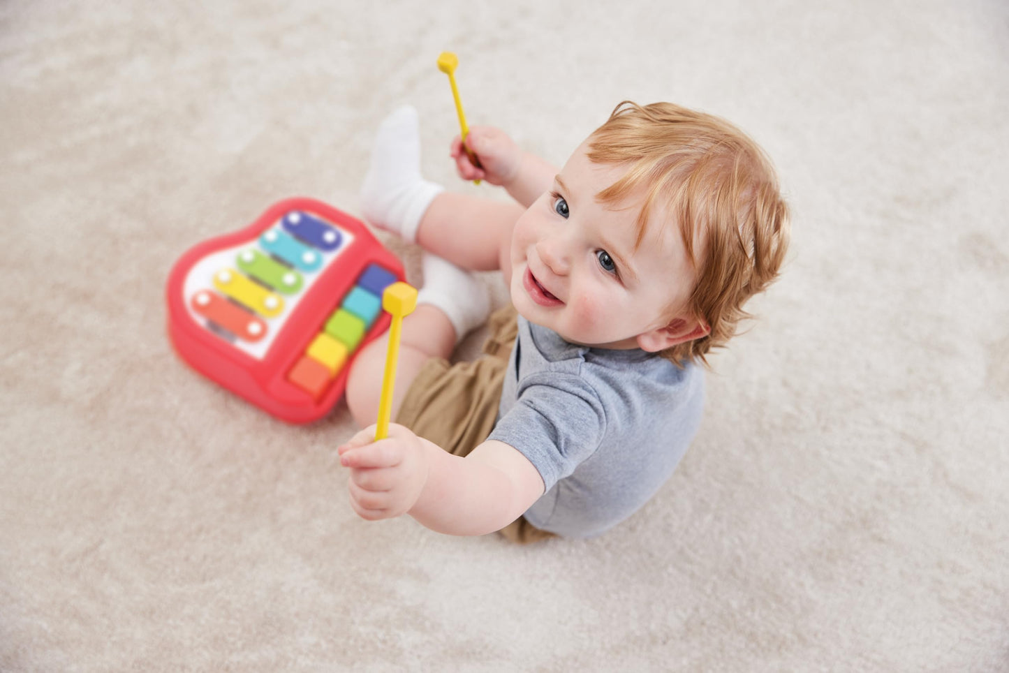 Compact travel-ready perspective of the battery-free Kidoozie piano xylophone toy.