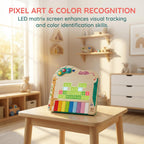 Toddler playing with the Hape interactive wooden piano instrument