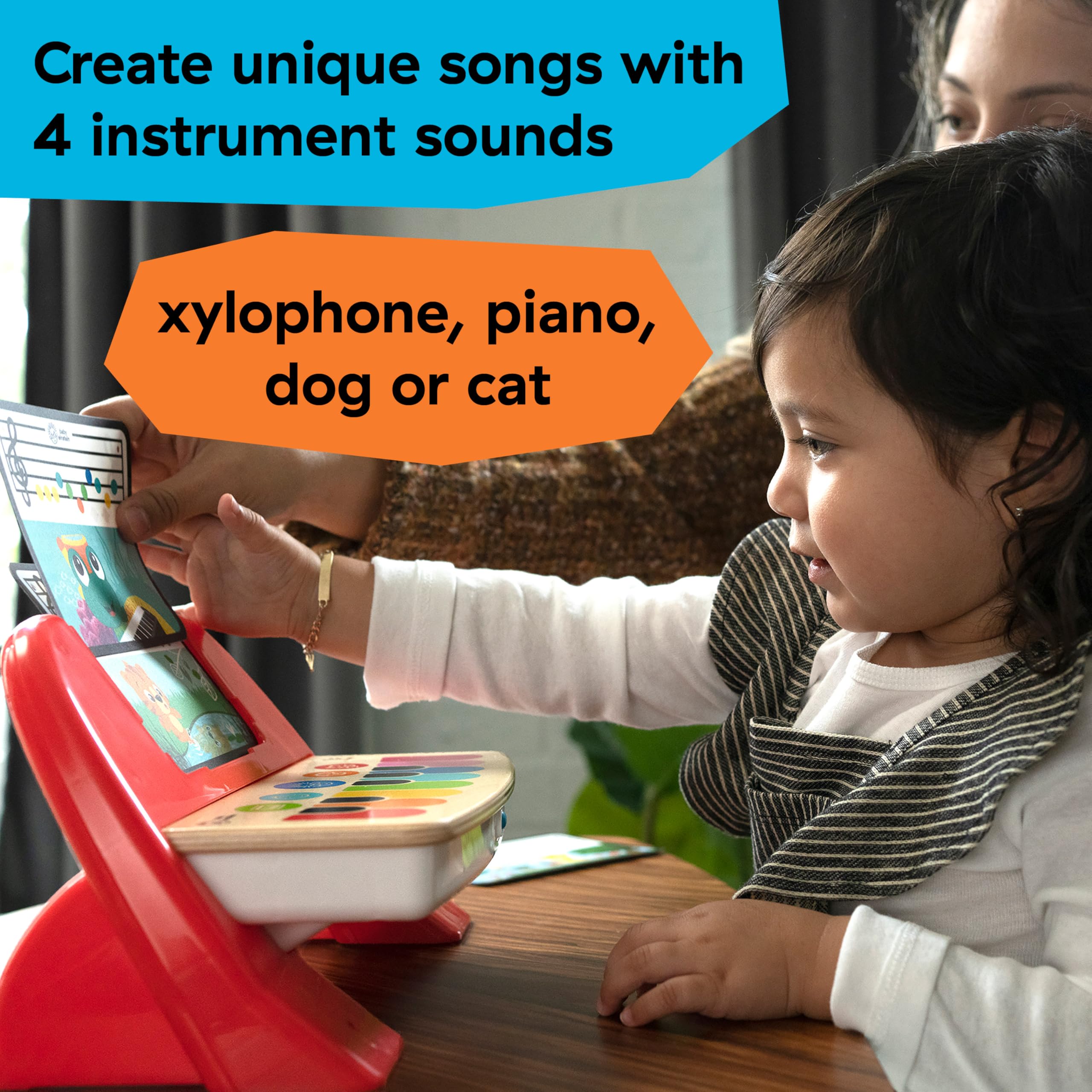 Montessori-inspired infant piano instrument with color-coded learning cards inserted into the top slot.