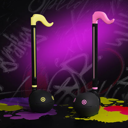 Otamatone Monster portable electronic music instrument being held ready to play