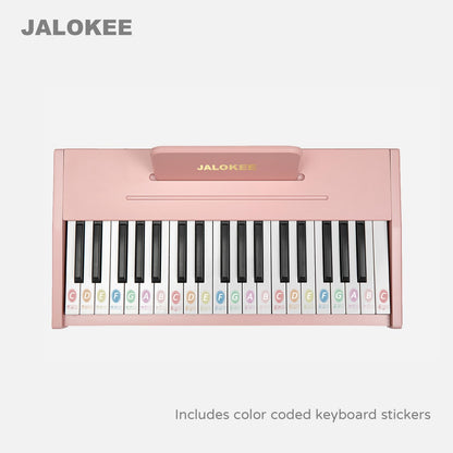 Durable children's electronic toy keyboard with colored stickers applied