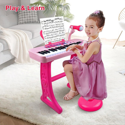 Detached portable setup of the pink beginner keyboard toy resting on a clean floor surface.