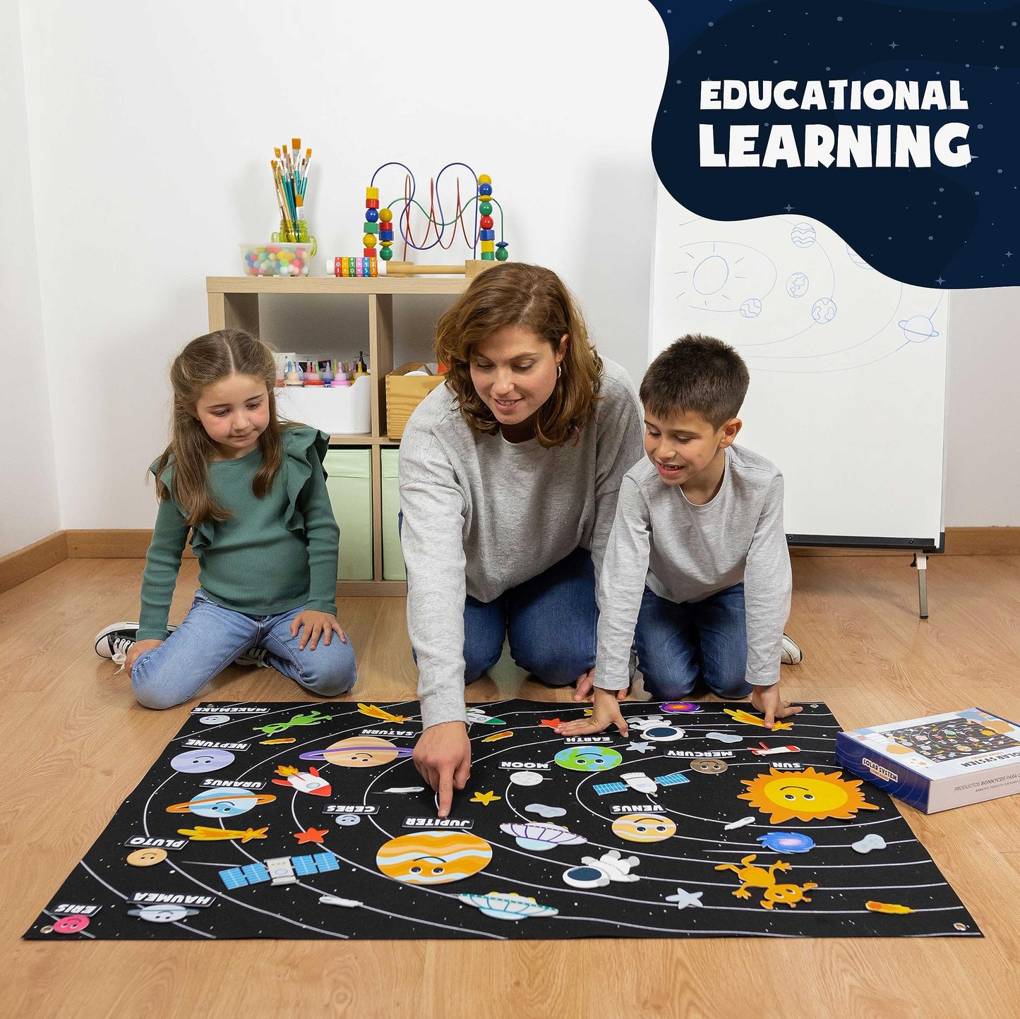 Educational astronomy kit packaging reference guide with dwarf planets and English name labels