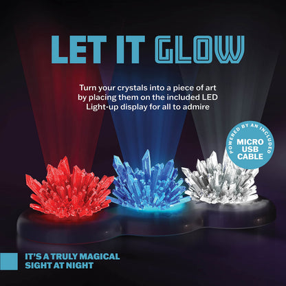 Close up view of fully formed red and blue crystals glowing brightly on an illuminated LED display stand.