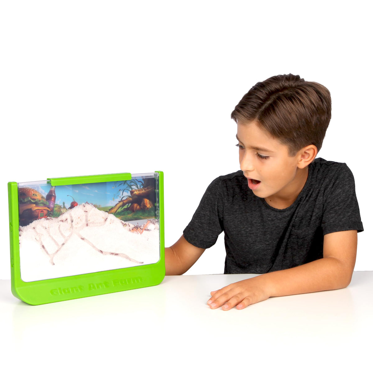 Child interacting with the green Uncle Milton nature learning habitat under secure supervision