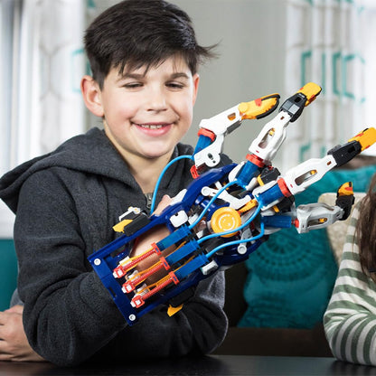 Wearable hydraulic cyborg hand showing mechanical fingers and water piston tubes being operated by a human hand