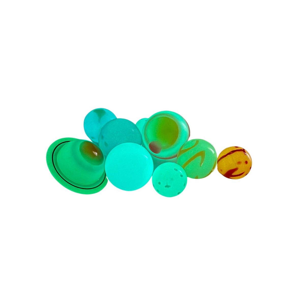 Bright green luminescent effect of the Glominite planetary models in a dark room