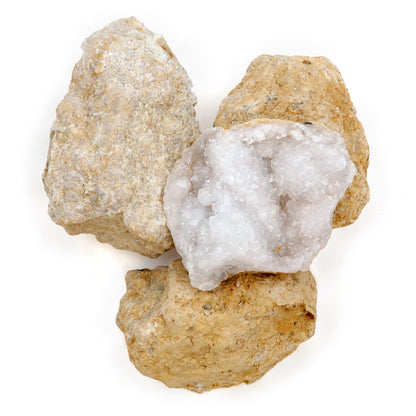 Natural round geode stone being placed inside a protective sock for safe cracking.