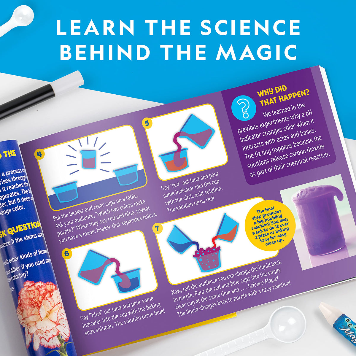 A child using the magic wand over a beaker showing a water color changing chemistry reaction