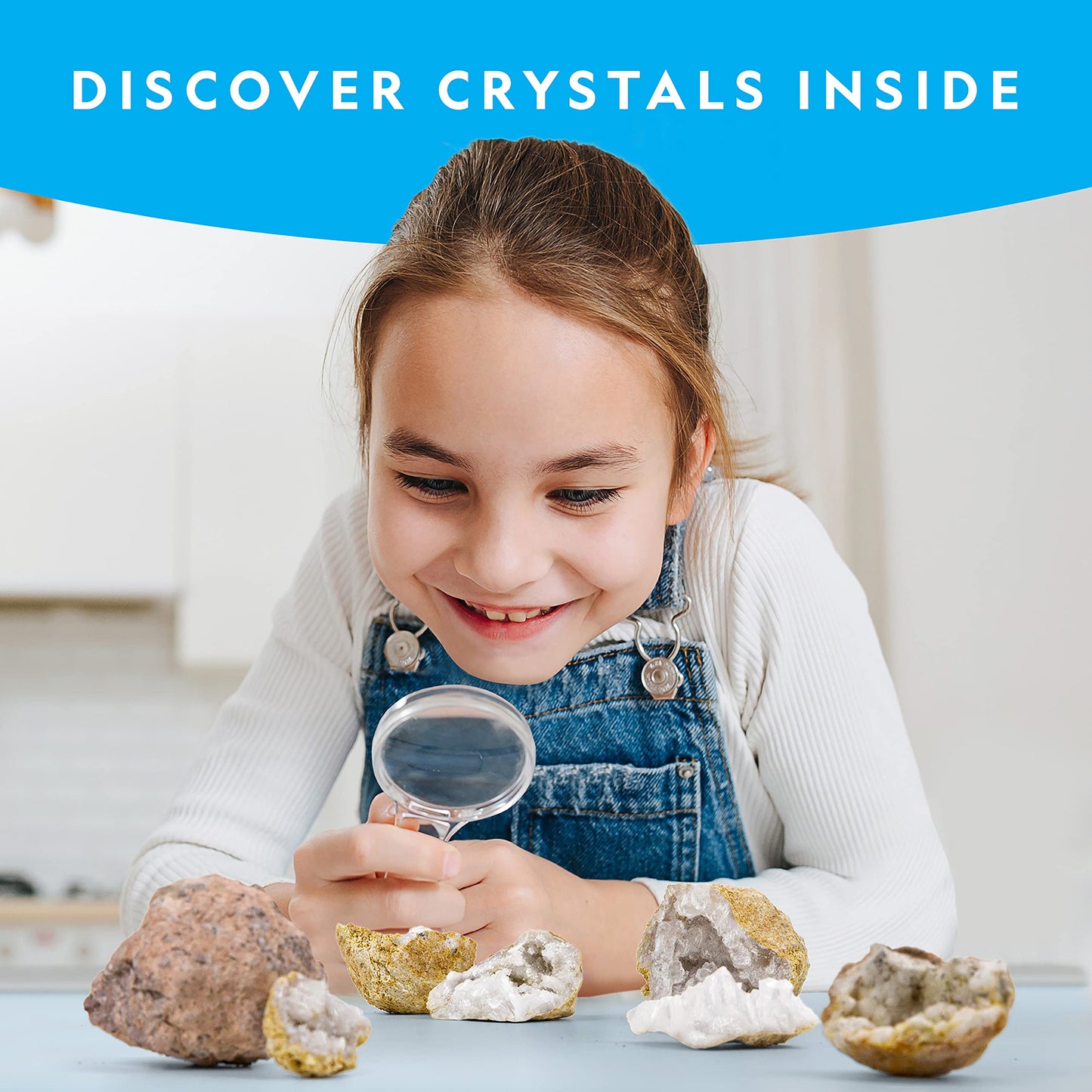 Ten real volcanic geode rocks unboxed with safety goggles and magnifying glass