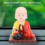 Tyenaza Red Monk Car Ornament displayed beautifully on a brightly lit office desk.