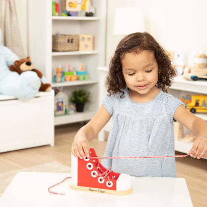 Wooden lacing shoe toy with red finish and extra long white lace