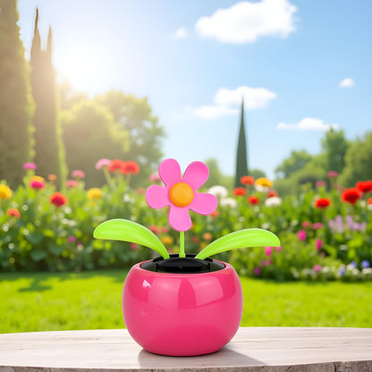 Eco friendly battery free pink daisy car decor window sun catcher close up.