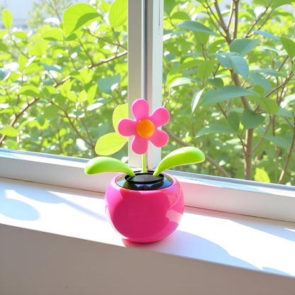 Charming pink floral bobblehead dancer dashboard decoration side view profile.
