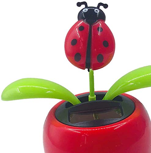 Taotenish solar bobblehead flowerpot toy showing green leaves on an office desk