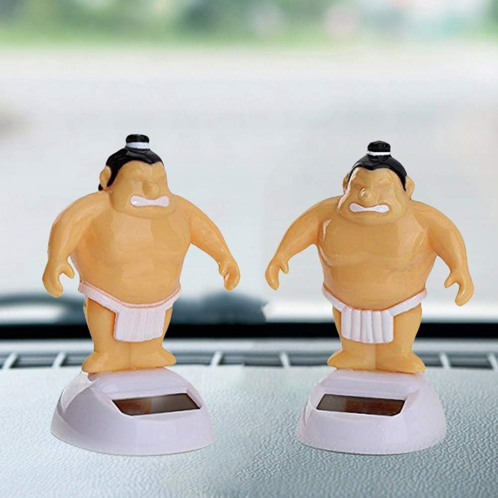 Angled perspective of the authentic imported sumo wrestler swinging dashboard figurine showing the durable plastic construction.