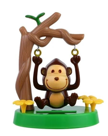 Cute solar monkey swinging animated bobble dancer on car interior panel