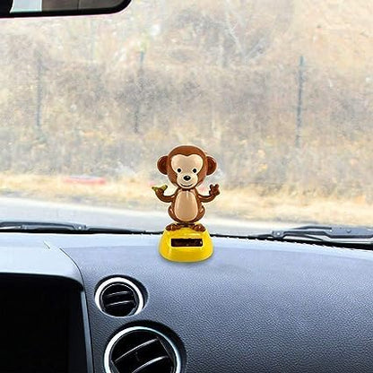 Authentic imported solar dancing monkey figurine close up showing solar panel